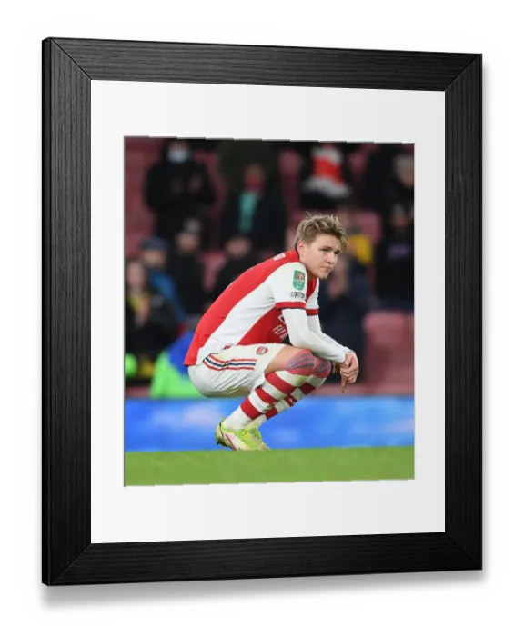 Framed Print : Martin Odegaard's Disappointment: Arsenal's Reaction to Carabao Cup Semi-Final Defeat at the Hands of Liverpool