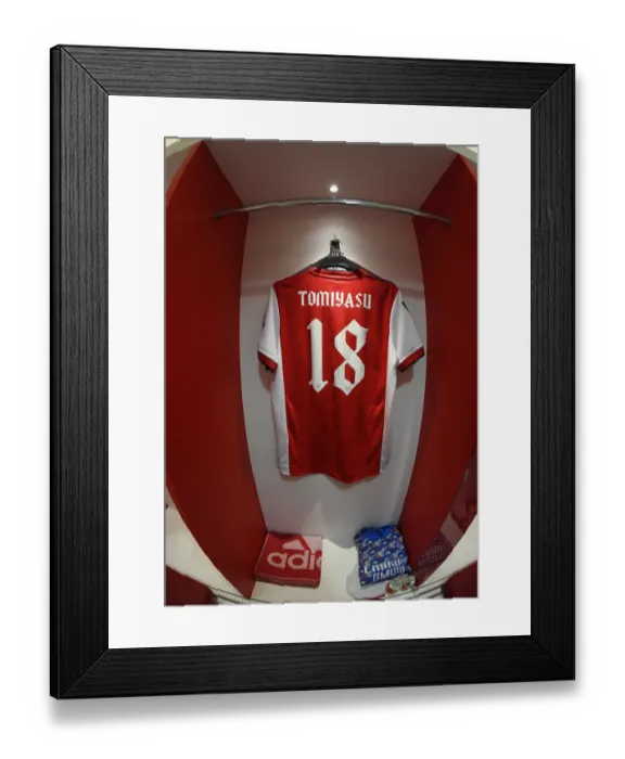 Framed Print : Arsenal's Empty Changing Room: Tomiyasu's Absence in Carabao Cup Semi-Final Against Liverpool Framed Print : Arsenal's Empty Changing Room: Tomiyasu's Absence in Carabao Cup Semi-Final Against Liverpool