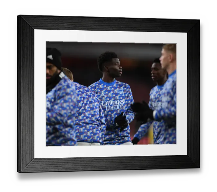 Framed Print : Arsenal's Bukayo Saka Prepares for Carabao Cup Showdown Against Liverpool
