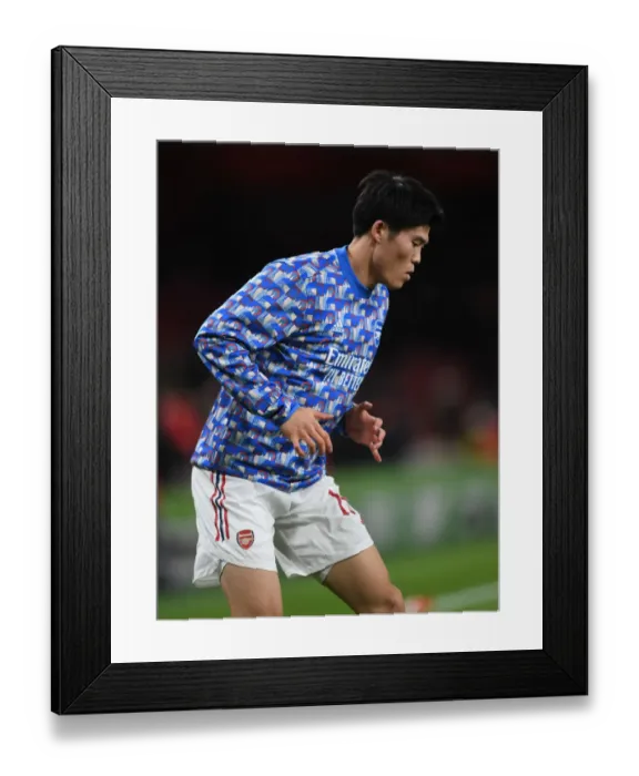 Framed Print : Arsenal's Takehiro Tomiyasu Prepares for Carabao Cup Showdown Against Liverpool