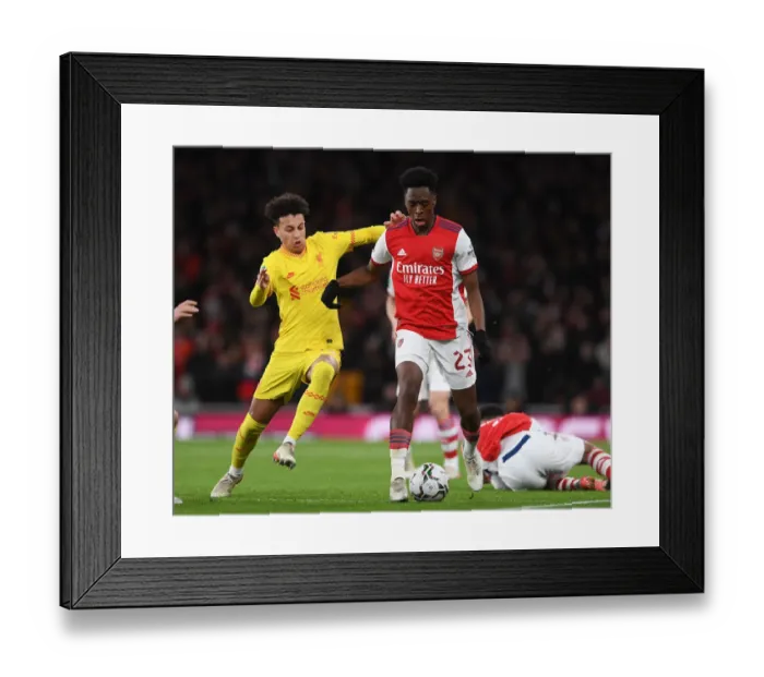 Framed Print : Arsenal vs Liverpool Showdown: Lokonga vs Gordon Battle for Carabao Cup Semi-Final Victory