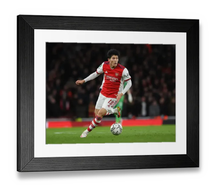 Framed Print : Arsenal's Tomiyasu Takes on Liverpool in Carabao Cup Semi-Final Clash Framed Print : Arsenal's Tomiyasu Takes on Liverpool in Carabao Cup Semi-Final Clash