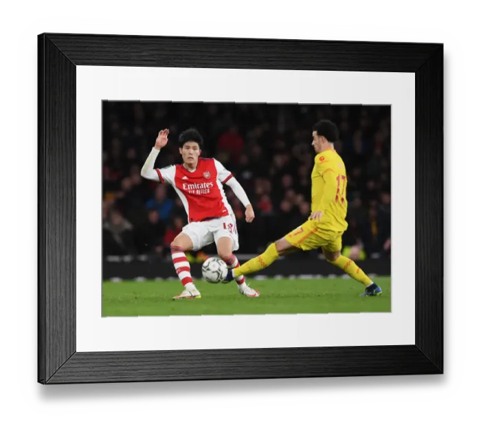Framed Print : Arsenal vs Liverpool Showdown: Tomiyasu Evades Jones in Intense Carabao Cup Clash