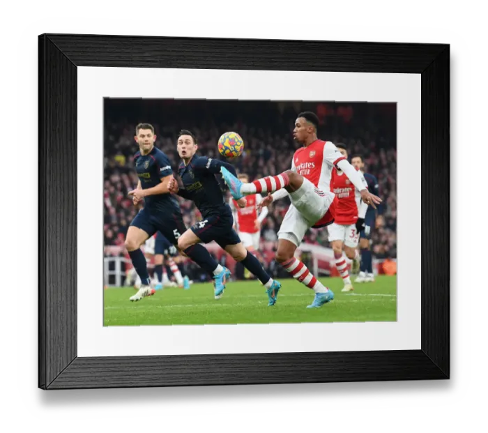 Framed Print : Arsenal's Gabriel Magalhaes Faces Off Against Burnley's Connor Roberts in Intense Premier League Clash Framed Print : Arsenal's Gabriel Magalhaes Faces Off Against Burnley's Connor Roberts in Intense Premier League Clash
