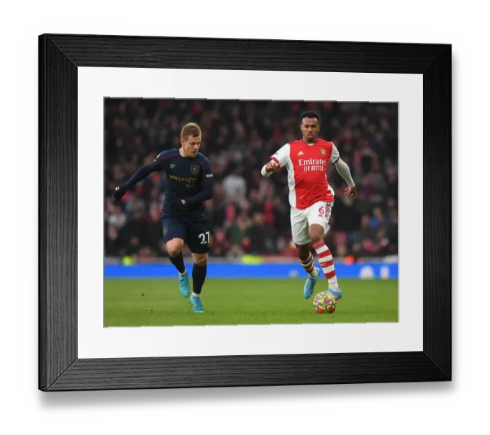 Framed Print : Arsenal's Gabriel Magalhaes Clashes with Burnley's Matej Vydra in Premier League Showdown