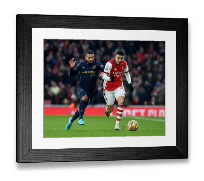 Framed Print : Arsenal's Martinelli Clashes with Burnley's Lennon in Premier League Showdown