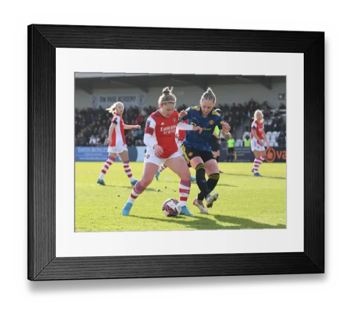 Framed Print : Arsenal vs Manchester United: A Fierce FA WSL Showdown - Battle of the Titans