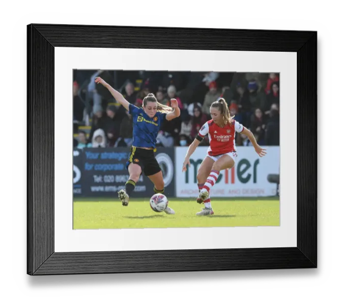 Framed Print : Intense Rivalry: Arsenal Women vs Manchester United Women in FA WSL Clash