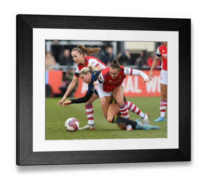 Framed Print : Arsenal vs Manchester United: Intense Battle in FA WSL Match - Caitlin Foord and Lia Walti vs Alessia Russo