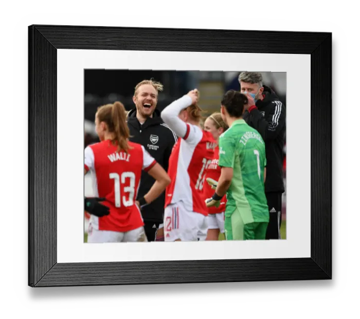 Framed Print : A Light-Hearted Moment: Arsenal's Jonas Eidevall and Manuela Zinsberger Share a Laugh on the Sidelines during Arsenal Women vs Manchester United Women Framed Print : A Light-Hearted Moment: Arsenal's Jonas Eidevall and Manuela Zinsberger Share a Laugh on the Sidelines during Arsenal Women vs Manchester United Women