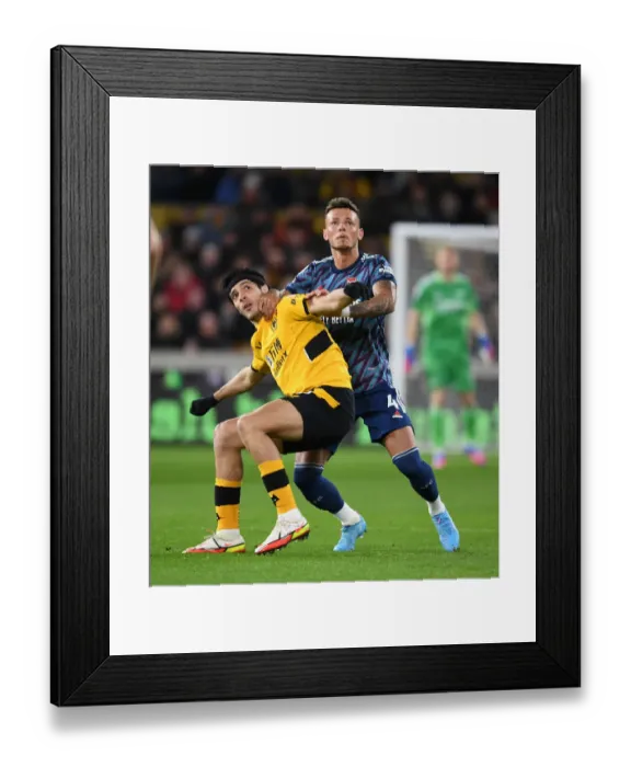 Framed Print : Arsenal's Ben White Fends Off Raul Jimenez in Intense Wolverhampton Wanderers Clash (Premier League 2021-22)