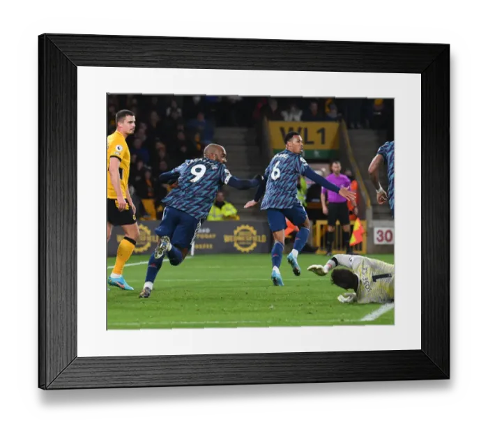 Framed Print : Gabriel and Lacazette Celebrate Arsenal's Goal Against Wolverhampton Wanderers in Premier League Match Framed Print : Gabriel and Lacazette Celebrate Arsenal's Goal Against Wolverhampton Wanderers in Premier League Match