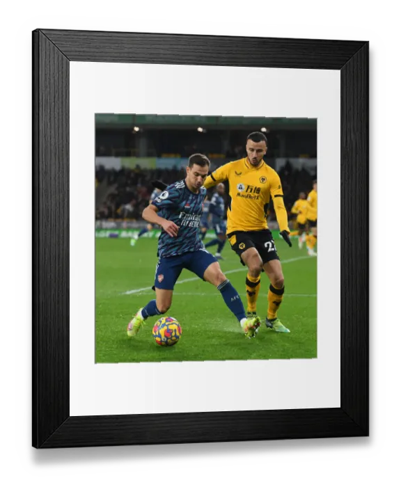 Framed Print : Arsenal's Cedric Clashes with Wolves Romain Saiss in Premier League Showdown Framed Print : Arsenal's Cedric Clashes with Wolves Romain Saiss in Premier League Showdown