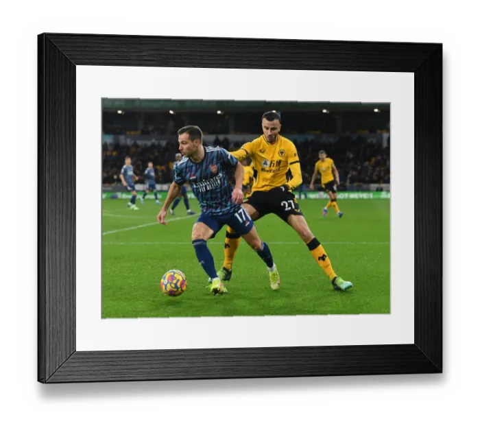 Framed Print : Arsenal's Cedric Goes Head-to-Head with Romain Saiss in Premier League Battle Framed Print : Arsenal's Cedric Goes Head-to-Head with Romain Saiss in Premier League Battle