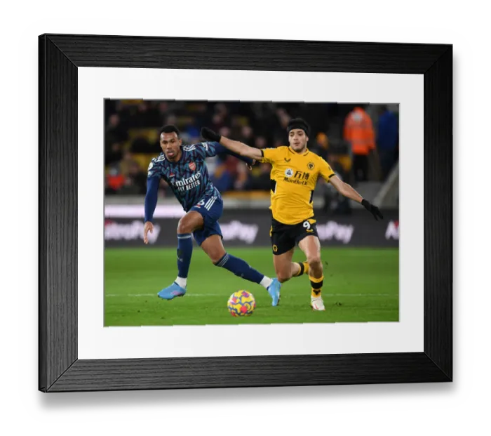 Framed Print : Gabriel vs. Jimenez: A Premier League Battle at Molineux