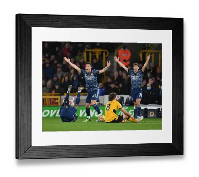 Framed Print : Arsenal's Xhaka and Tierney Protest Referee Decision in Wolverhampton Wanderers Clash (2021-22) Framed Print : Arsenal's Xhaka and Tierney Protest Referee Decision in Wolverhampton Wanderers Clash (2021-22)
