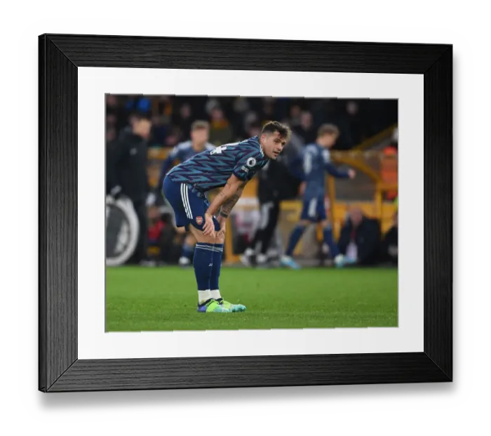 Framed Print : Granit Xhaka's Brilliant Midfield Performance: Arsenal Triumphs Over Wolverhampton Wanderers, Premier League 2021-22
