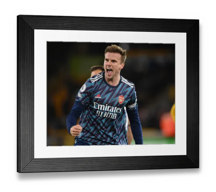 Framed Print : Rob Holding's Exultant Moment: Arsenal's Triumph over Wolverhampton Wanderers in the Premier League