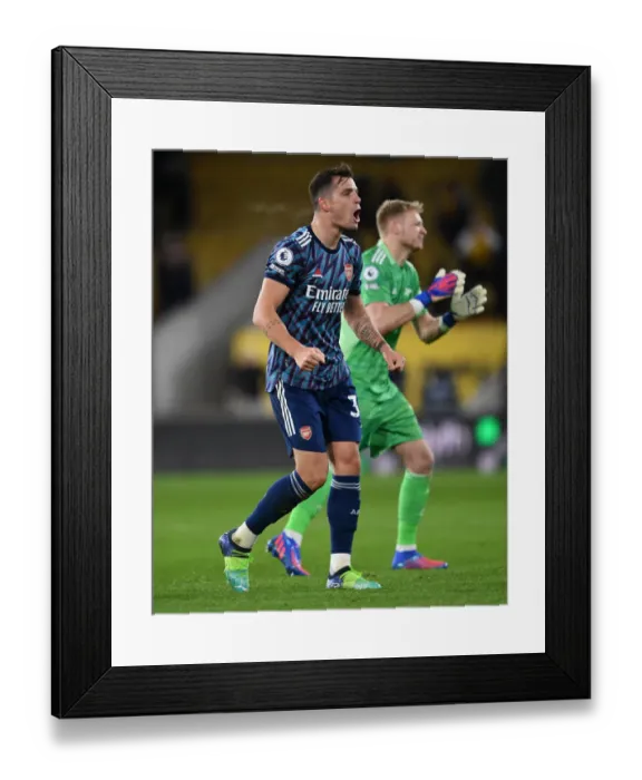 Framed Print : Granit Xhaka's Euphoric Celebration: Arsenal's Triumph at Wolverhampton Wanderers, Premier League 2021-22
