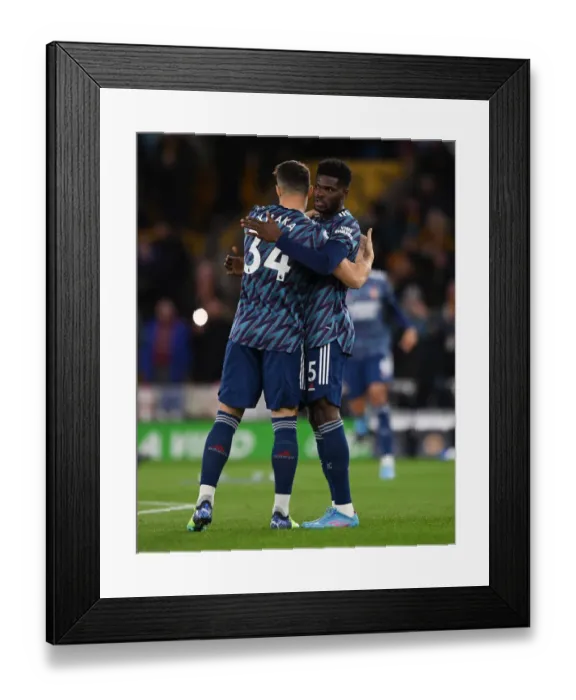 Framed Print : Arsenal's Partey and Xhaka Embrace Amidst Premier League Battle: Wolverhampton Wanderers vs Arsenal (2021-22) Framed Print : Arsenal's Partey and Xhaka Embrace Amidst Premier League Battle: Wolverhampton Wanderers vs Arsenal (2021-22)
