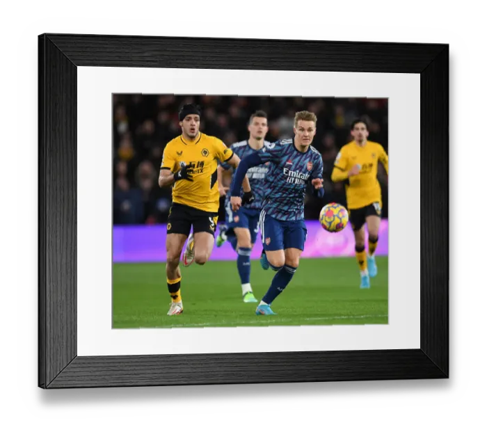 Framed Print : Martin Odegaard vs Raul Jimenez: Battle at Molineux - Wolverhampton Wanderers vs Arsenal, Premier League 2021-22