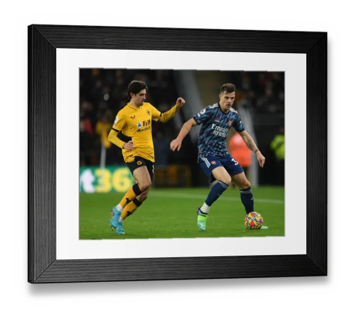 Framed Print : Xhaka vs Trincao: Intense Battle in Wolverhampton Wanderers vs Arsenal Premier League Clash Framed Print : Xhaka vs Trincao: Intense Battle in Wolverhampton Wanderers vs Arsenal Premier League Clash