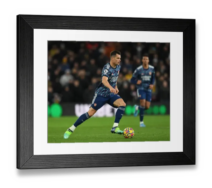 Framed Print : Granit Xhaka: Arsenal's Midfield Battle in Wolverhampton Premier League Clash 2021-22