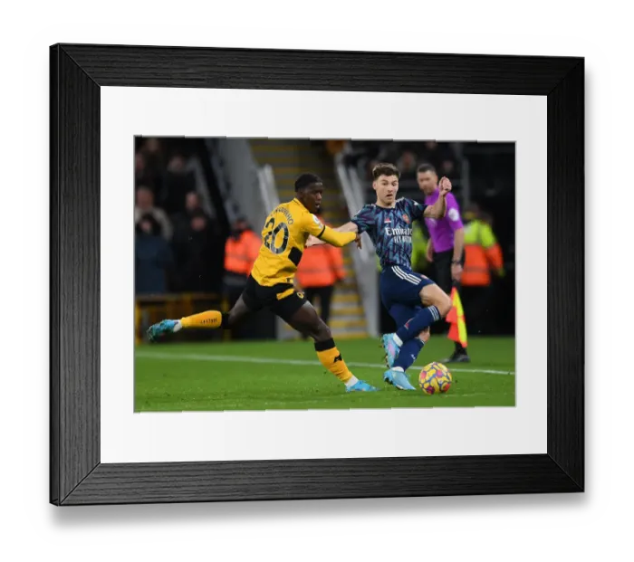 Framed Print : Arsenal's Kieran Tierney Faces Pressure from Wolves Francisco Trincao in Premier League Clash