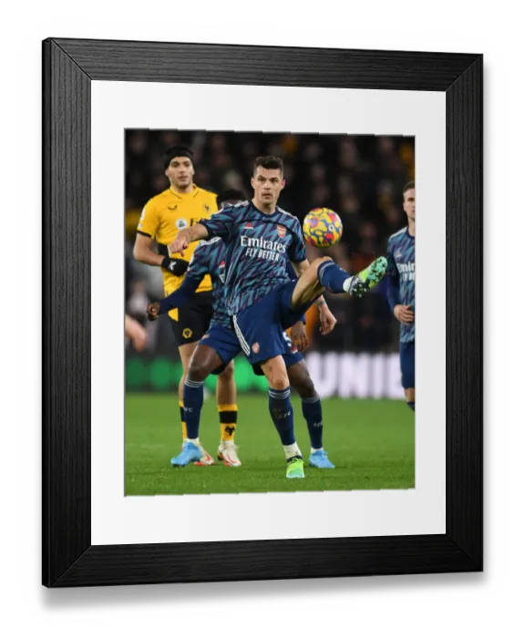 Framed Print : Granit Xhaka: Arsenal's Midfield Mastermind in Action against Wolverhampton Wanderers, Premier League 2021-22