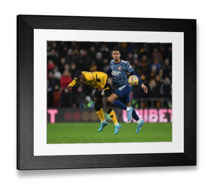 Framed Print : Gabriel Magalhaes vs. Francisco Trincao: Intense Clash Between Wolverhampton Wanderers and Arsenal in Premier League