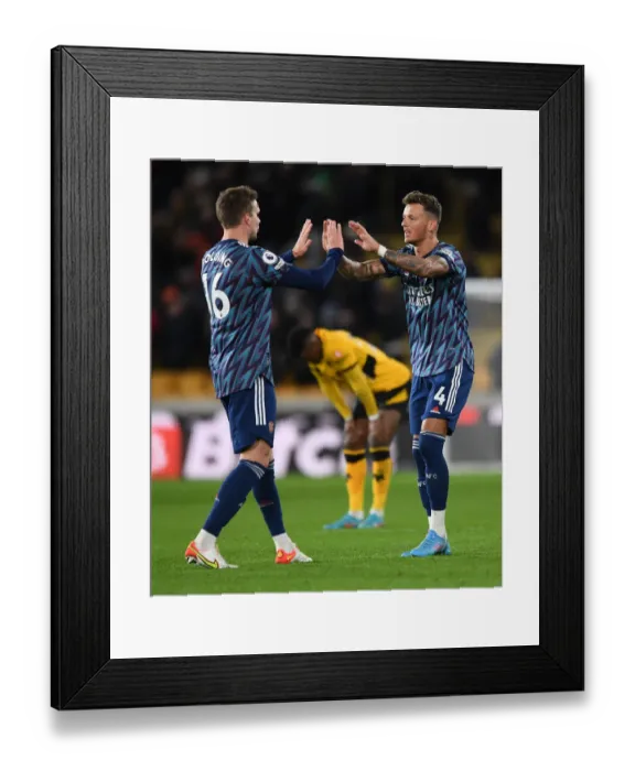 Framed Print : Arsenal's Holding and White Celebrate Victory Over Wolverhampton Wanderers in Premier League Framed Print : Arsenal's Holding and White Celebrate Victory Over Wolverhampton Wanderers in Premier League