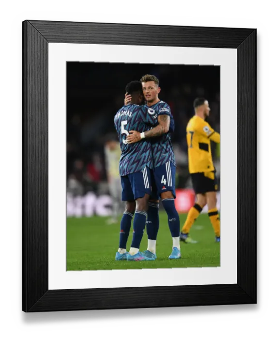Framed Print : Arsenal's Thomas Partey and Ben White Celebrate Victory Over Wolverhampton Wanderers in Premier League