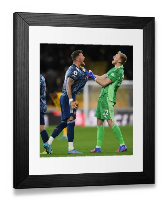 Framed Print : Arsenal's Triumphant Moment: Ben White and Aaron Ramsdale Celebrate Victory over Wolverhampton Wanderers in Premier League 2021-22