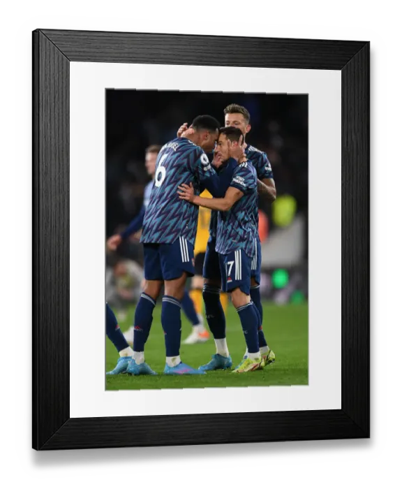 Framed Print : Arsenal's Gabriel Magalhaes and Cedric Soares Celebrate Victory Over Wolverhampton Wanderers in Premier League Framed Print : Arsenal's Gabriel Magalhaes and Cedric Soares Celebrate Victory Over Wolverhampton Wanderers in Premier League