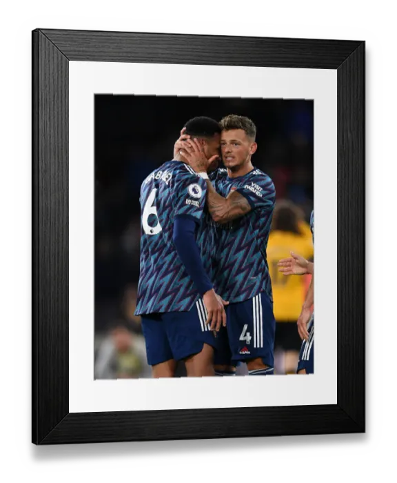Framed Print : Arsenal's Defensive Duo Celebrate Win Against Wolverhampton Wanderers in Premier League