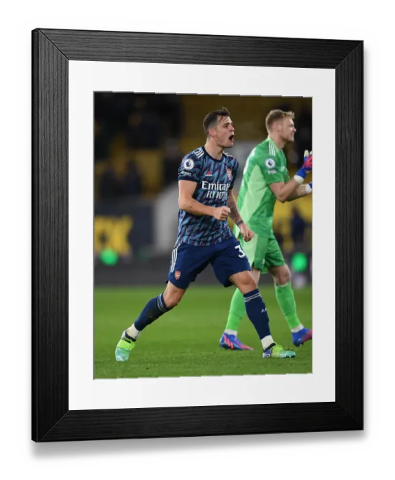 Framed Print : Granit Xhaka's Euphoric Celebration: Arsenal's Triumph at Wolverhampton Wanderers, Premier League 2021-22