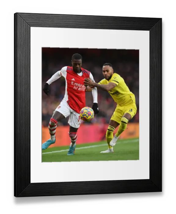 Framed Print : Pepe vs Henry: Intense Rivalry Revisited - Arsenal vs Brentford, Premier League Showdown Framed Print : Pepe vs Henry: Intense Rivalry Revisited - Arsenal vs Brentford, Premier League Showdown