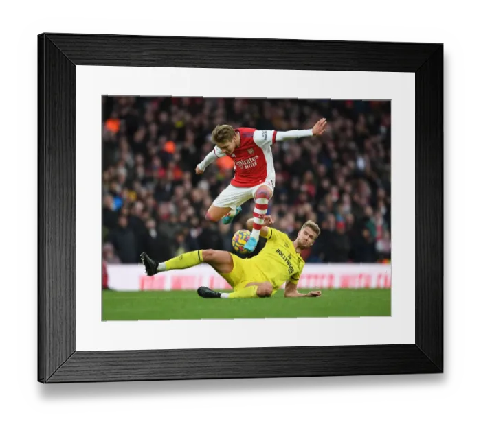 Framed Print : Odegaard vs. Ajer: A Premier League Battle at Arsenal Stadium