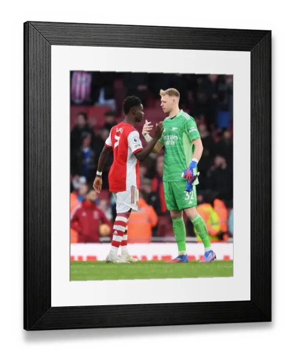 Framed Print : Arsenal's Saka and Ramsdale: Unstoppable Victory Duo Celebrate Against Brentford
