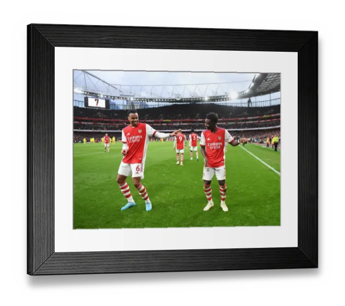 Framed Print : Arsenal's Saka and Gabriel: Celebrating a Glorious Second Goal Against Brentford (2021-22)