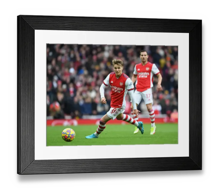 Framed Print : Martin Odegaard Shines: Arsenal's Triumph Over Brentford in the Premier League Framed Print : Martin Odegaard Shines: Arsenal's Triumph Over Brentford in the Premier League
