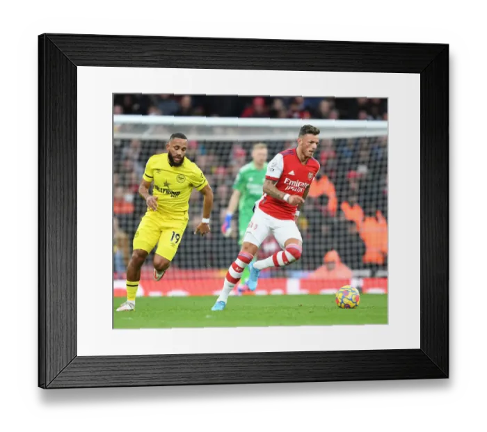 Framed Print : Arsenal's Ben White Outsmarts Brentford's Mbeumo: A Premier League Showdown at Emirates Stadium Framed Print : Arsenal's Ben White Outsmarts Brentford's Mbeumo: A Premier League Showdown at Emirates Stadium