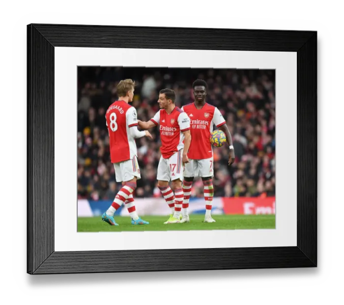 Framed Print : Arsenal's Odegaard, Cedric, and Saka in Action against Brentford (2021-22) Framed Print : Arsenal's Odegaard, Cedric, and Saka in Action against Brentford (2021-22)