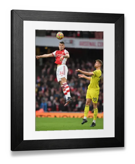 Framed Print : Xhaka Soaring High: Arsenal vs. Brentford, Premier League 2021-22 Framed Print : Xhaka Soaring High: Arsenal vs. Brentford, Premier League 2021-22