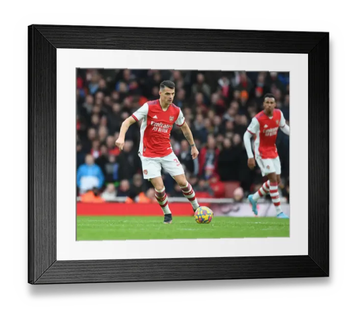 Framed Print : Granit Xhaka: Arsenal's Midfield Maestro in Action against Brentford, Premier League 2021-22