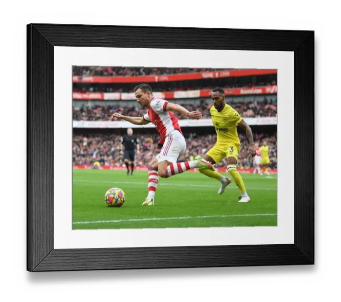 Framed Print : Arsenal vs Brentford: Cedric Clashes with Rico Henry in Premier League Showdown