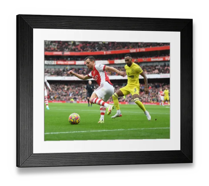 Framed Print : Arsenal vs Brentford: A Premier League Battle - Cedric vs Rico Henry Framed Print : Arsenal vs Brentford: A Premier League Battle - Cedric vs Rico Henry