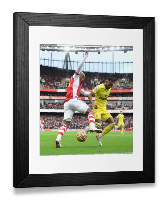 Framed Print : Arsenal's Lacazette vs. Henry: A Legendary Clash on the Emirates Field