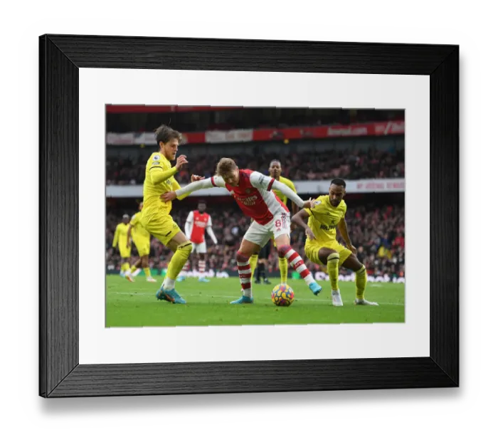 Framed Print : Arsenal's Martin Odegaard Faces Off Against Brentford's Mathias Jensen and Rico Henry in Intense Premier League Showdown Framed Print : Arsenal's Martin Odegaard Faces Off Against Brentford's Mathias Jensen and Rico Henry in Intense Premier League Showdown