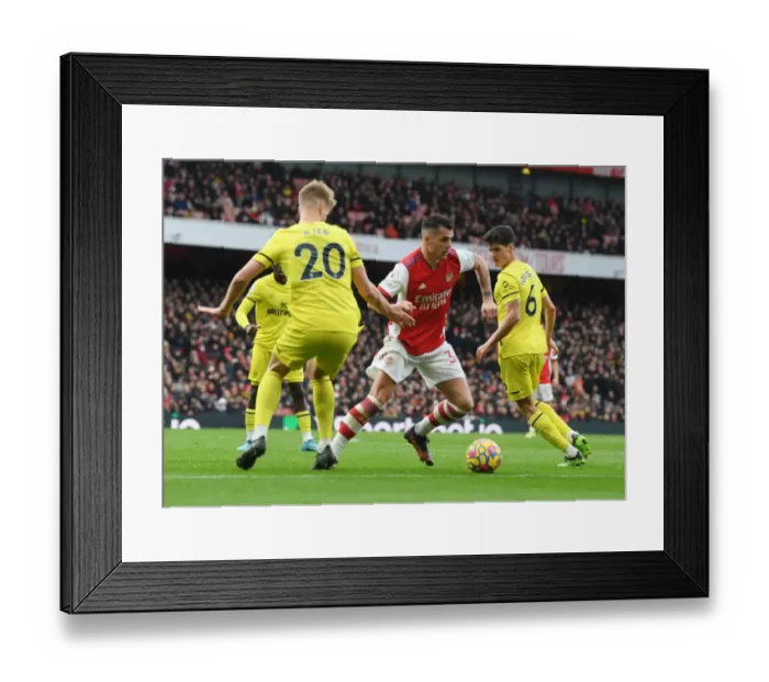 Framed Print : Granit Xhaka Breaks Past Defenders in Arsenal's Victory over Brentford (Arsenal v Brentford, Premier League 2021-22) Framed Print : Granit Xhaka Breaks Past Defenders in Arsenal's Victory over Brentford (Arsenal v Brentford, Premier League 2021-22)